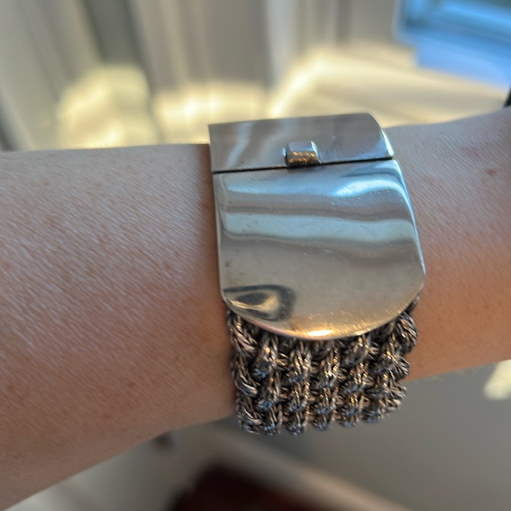 Sterling silver woven cuff with large closure.